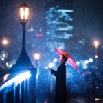 woman standing aside of the light on a bridge in Osaka