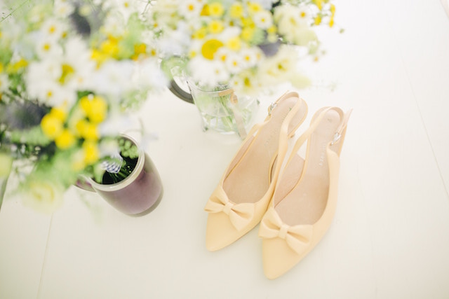 egg-shell-color-shoes with yellow flowers