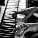 hands playing piano